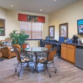 a living room with a tv and dining table