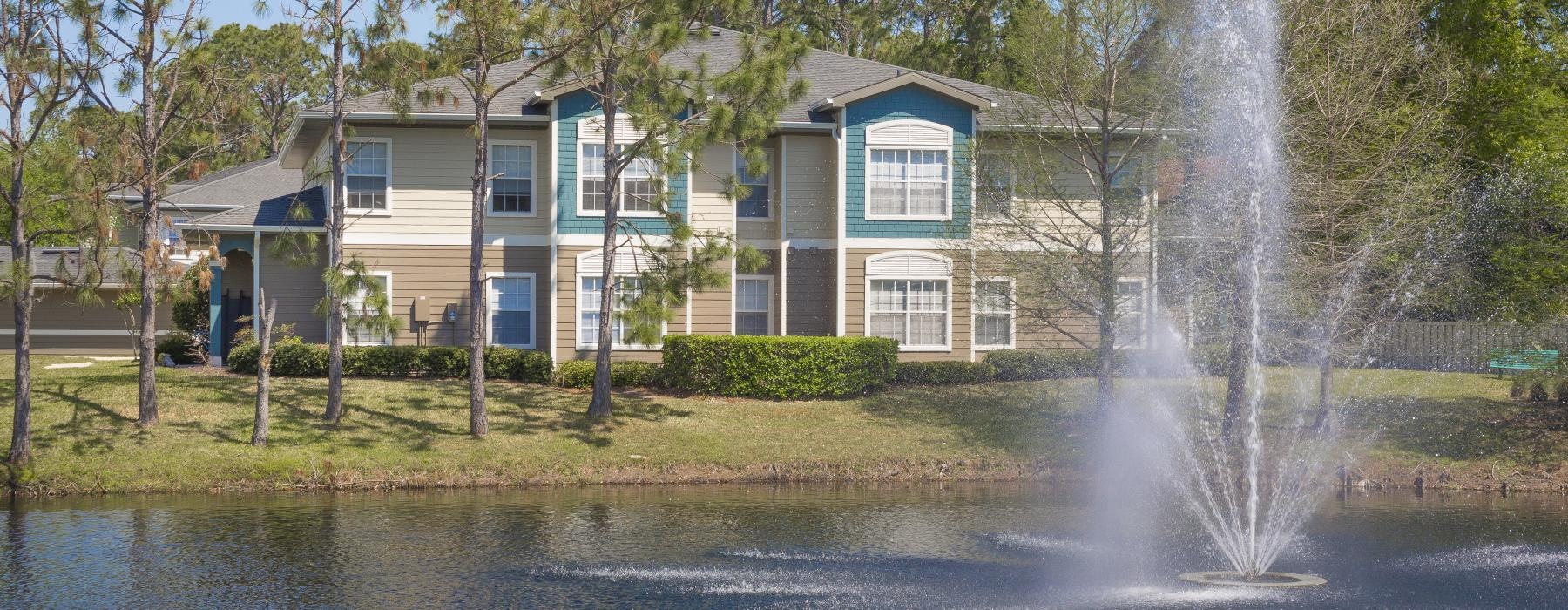 a house with a fountain in the front