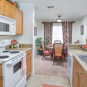 a kitchen with a stove and a sink